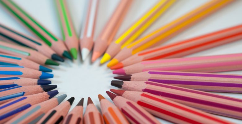 Coming up with article ideas. Photo of a circle of colored pencils. Photo credit: Agency Olloweb, via Unsplash.