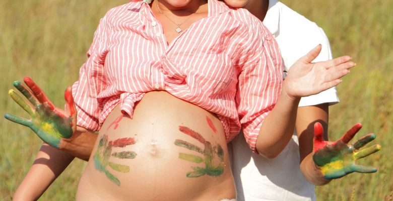 Doctors need to stop bullying pregnant women. Pregnancy is a state of good health and happiness, not a disaster waiting to happen (photo of a pregnant woman doing art on her belly courtesy of Pixabay)
