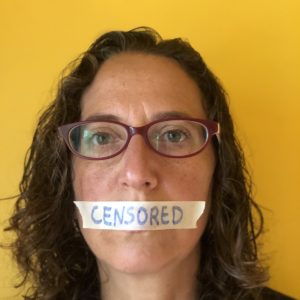 Censorship in America has gotten out of hand. Facebook, YouTube, Medium, even Amazon are all actively censoring alternative health information and anything that doesn't fit the "religious" left narrative. Photo of a woman with masking tape over her mouth. | Jennifer Margulis.