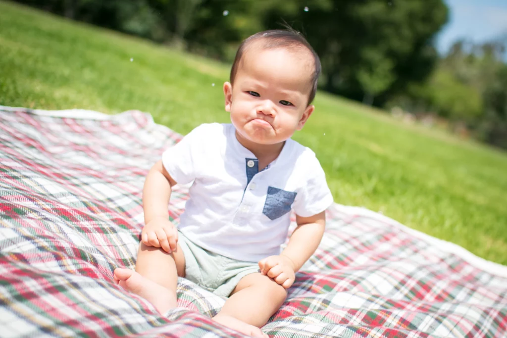 Doctors need to tell parents the truth about MiraLAX, a dangerous drug for kids. Photo of a pouting baby via Unsplash. | Jennifer Margulis, Ph.D.